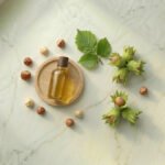 Fındık yağı ve Corylus avellana — kabuklu fındıklar ve yeşil yapraklar